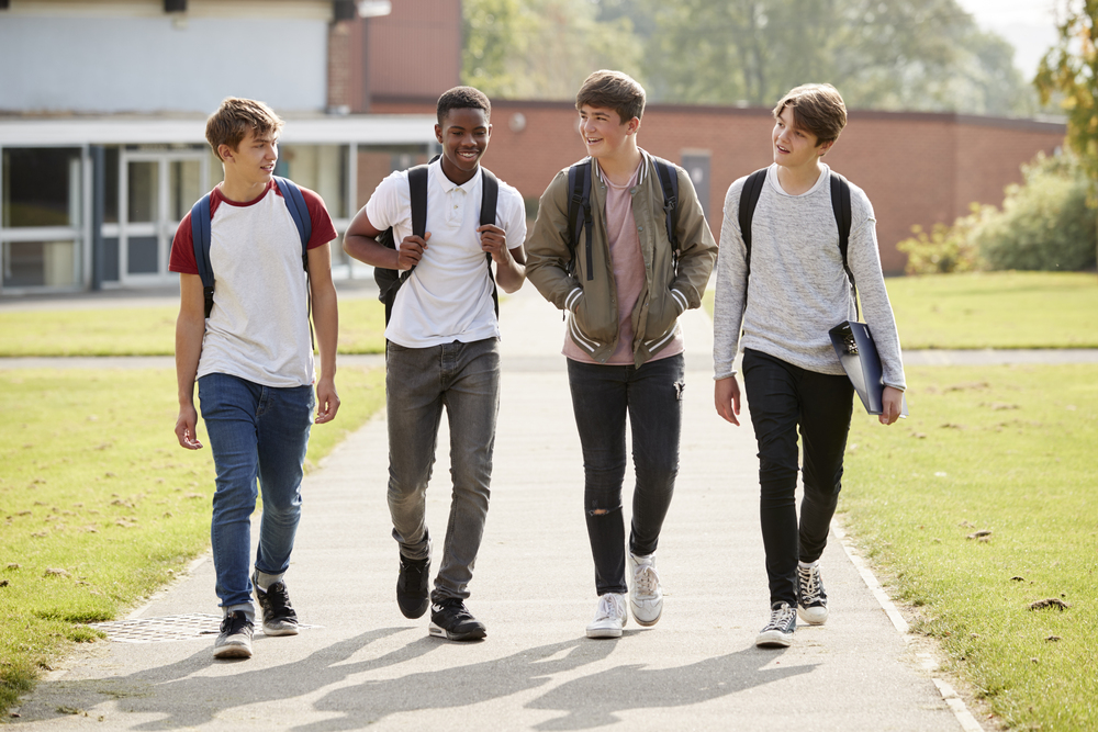 group-of-male-teenage-students-walking-around-coll-PM9WFQ5.jpg